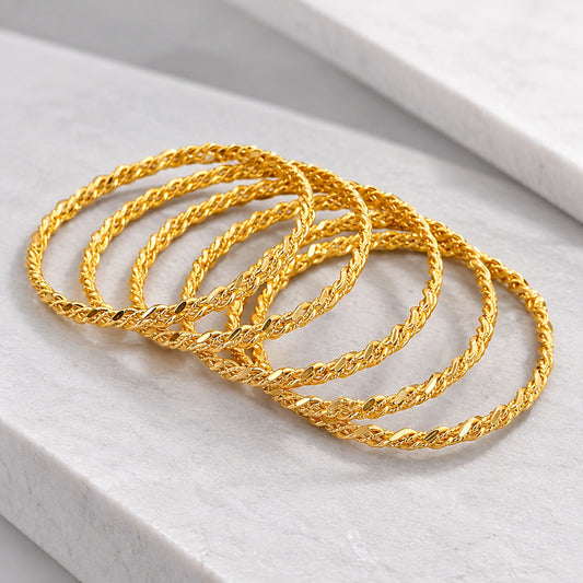 Stylish twisted gold-tone bangles for women