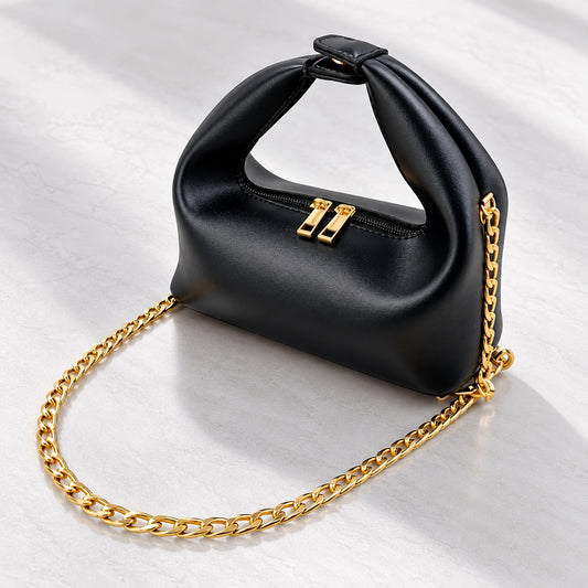 Luxury black women’s handbag with gold chain strap
